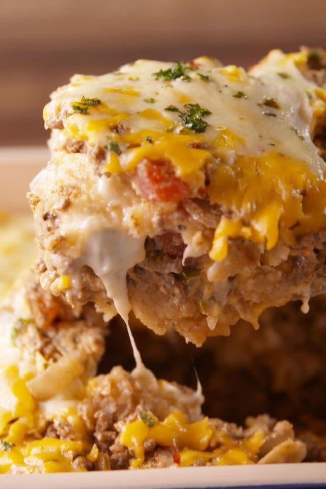 <p>This cheesy bake will have you begging for more, seriously. </p><p>Get the <a href="https://www.delish.com/uk/cooking/recipes/a32833037/cheesy-taco-bake-recipe/" rel="nofollow noopener" target="_blank" data-ylk="slk:Cheesy Taco Bake;elm:context_link;itc:0;sec:content-canvas" class="link ">Cheesy Taco Bake</a> recipe. </p>