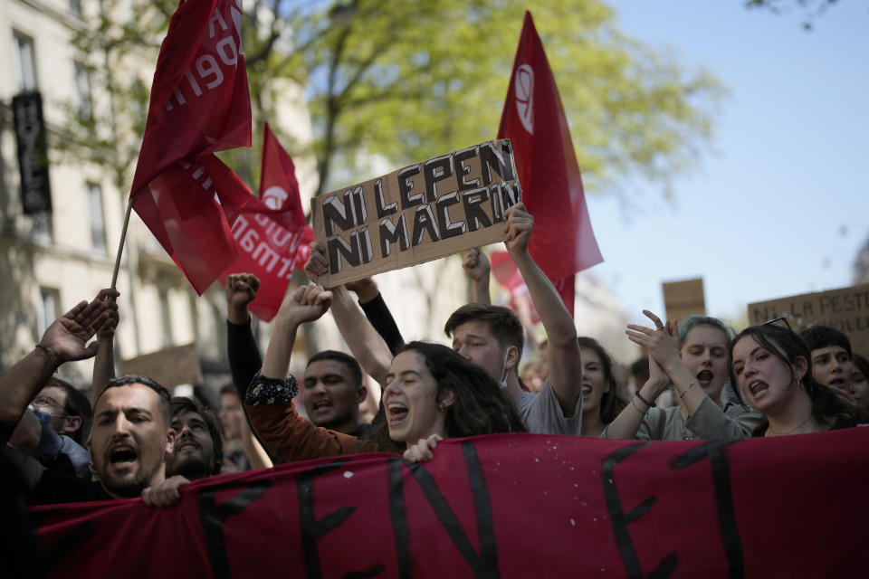 FILE - A demonstrator holds a banner that reads: 'Neither Macron nor Le Pen', during a protest in Paris, April 16, 2022. Disgruntled left-wing voters whose candidates were knocked out in the first round of France's election are the wild cards in the winner-takes-all runoff on Sunday April 24, 2022. How they vote — or don’t vote — will in large part determine whether incumbent Emmanuel Macron gets a second five-year term or cedes the presidential Elysee Palace to far-right nationalist Marine Le Pen. (AP Photo/Christophe Ena, File)