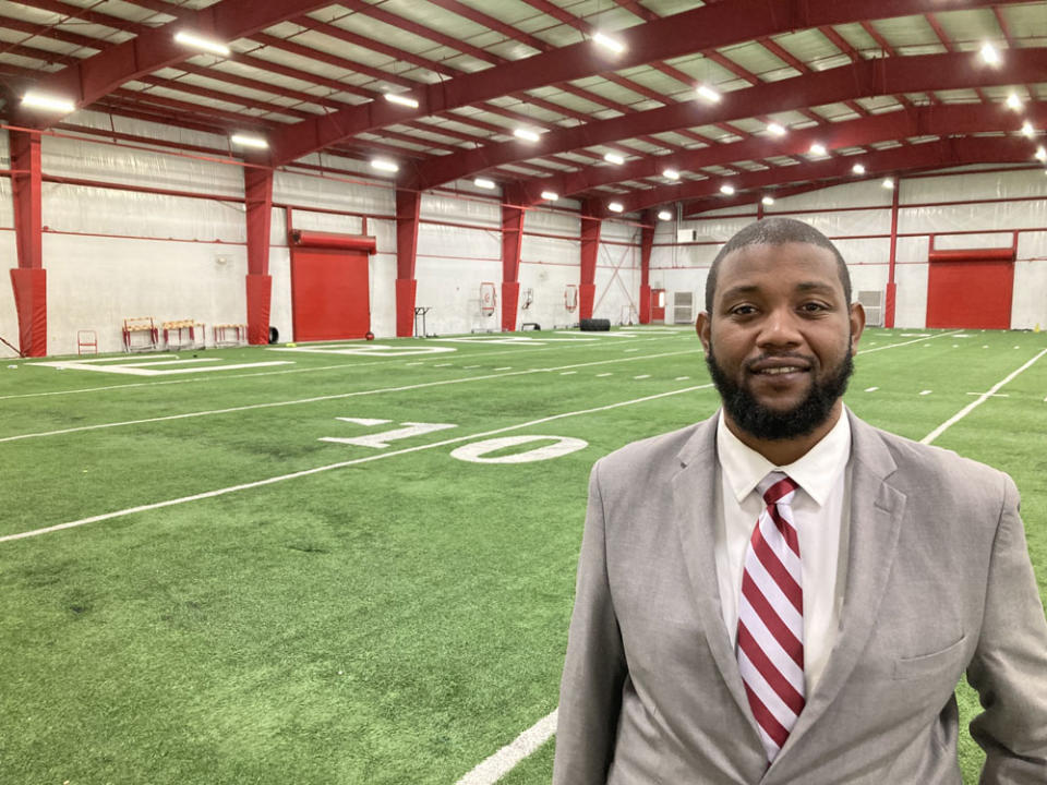 Pine Bluff High School football coach Micheal Williams stands on the team’s indoor practice field in February 2024.