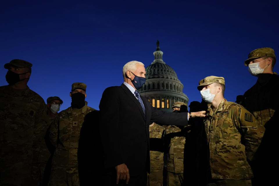 Vice President Mike Pence speaks to National Guard troops outside the U.S. Capitol, Thursday, Jan. 14, 2021, in Washington. (AP Photo/Alex Brandon, Pool)