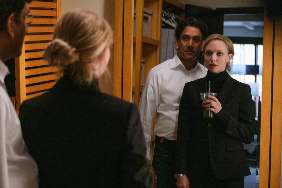 Theranos CEO Elizabeth Holmes (Amanda Seyfried) embraces a new, more sophisticated look beside her boyfriend, Sunny Balwani (Naveen Andrews).