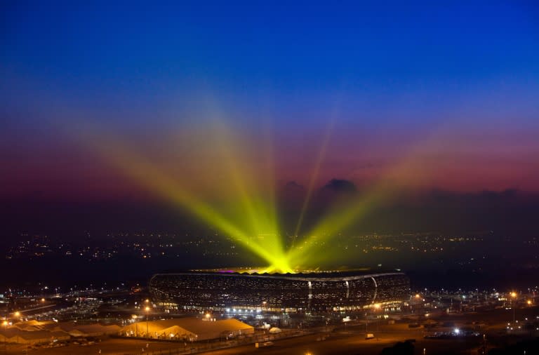 Light beams shine out from the Soccer City stadium in Soweto, a suburb of Johannesburg, during the 2010 World Cup in South Africa