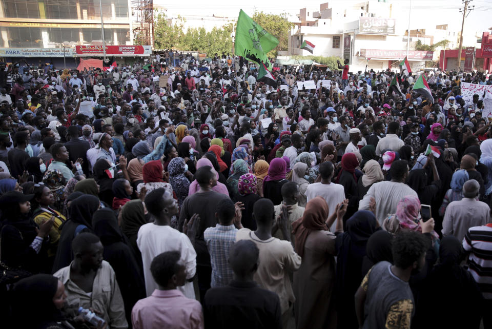 People chant slogans during a protest in Khartoum, Sudan, Saturday, Oct. 30, 2021. Pro-democracy groups called for mass protest marches across the country Saturday to press demands for re-instating a deposed transitional government and releasing senior political figures from detention. (AP Photo/Marwan Ali)