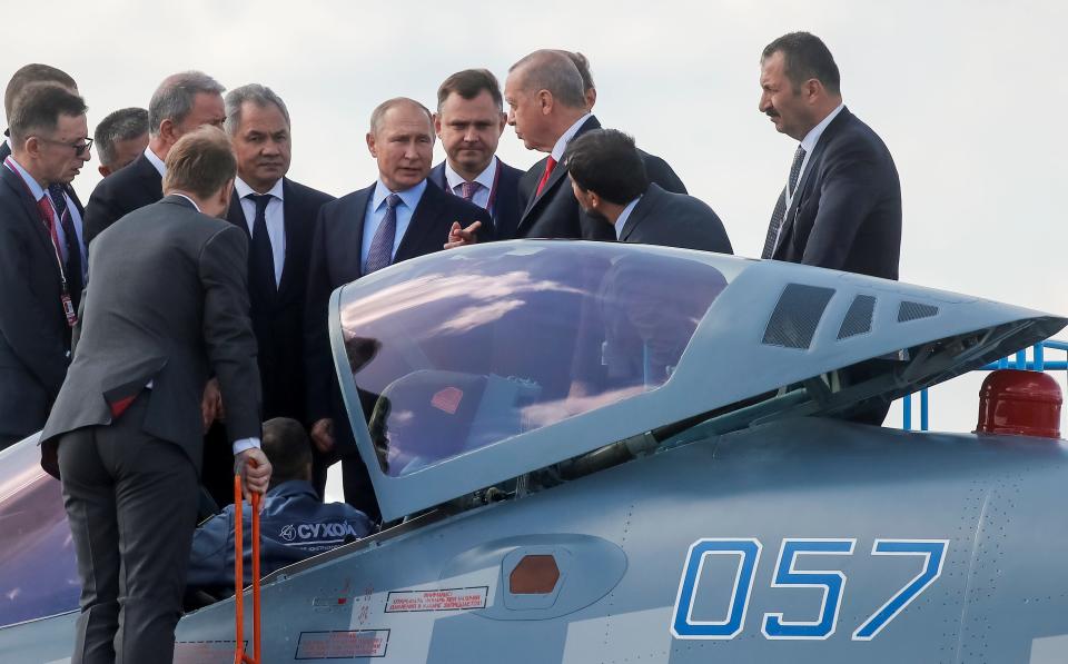 Russian President Vladimir Putin and his Turkish counterpart Recep Tayyip Erdogan talk next to a Sukhoi Su-57 fighter jet as they visit the MAKS 2019 air show in Zhukovsky, outside Moscow, Russia, August 27, 2019.