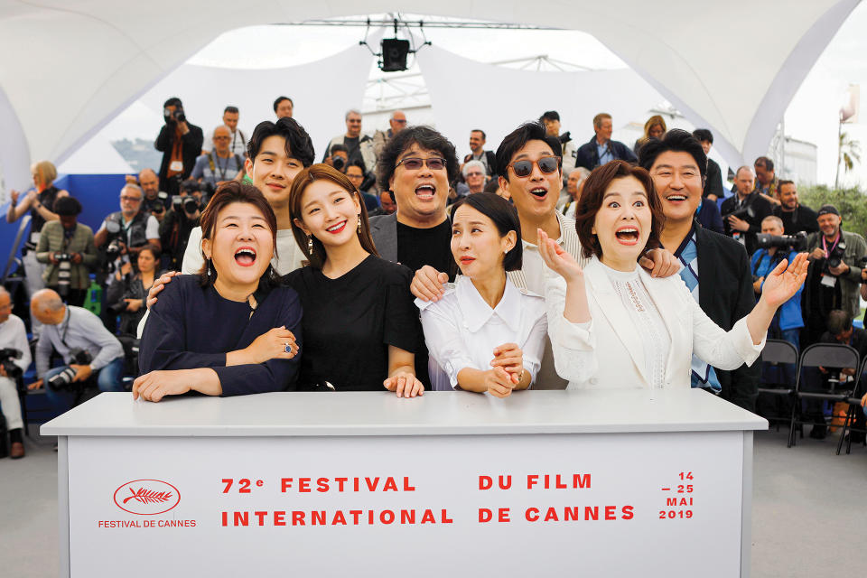 The “Parasite” cast and helmer Bong Joon Ho (center back row) kicked off the film at the 2019 Cannes fest, where it started its journey to its historic best picture Oscar win. - Credit: AP