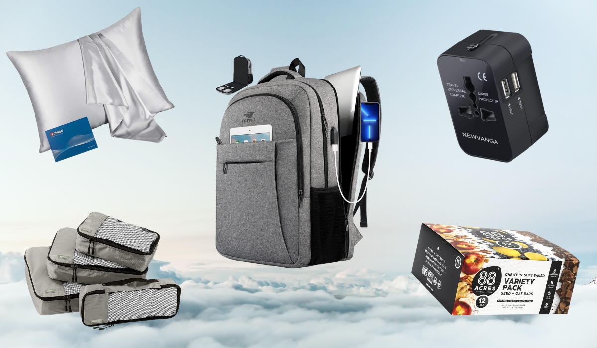 Assorted travel items against a cloud background including a backpack, silk pillowcase, packing cubes, box of granola bars, and travel adapter