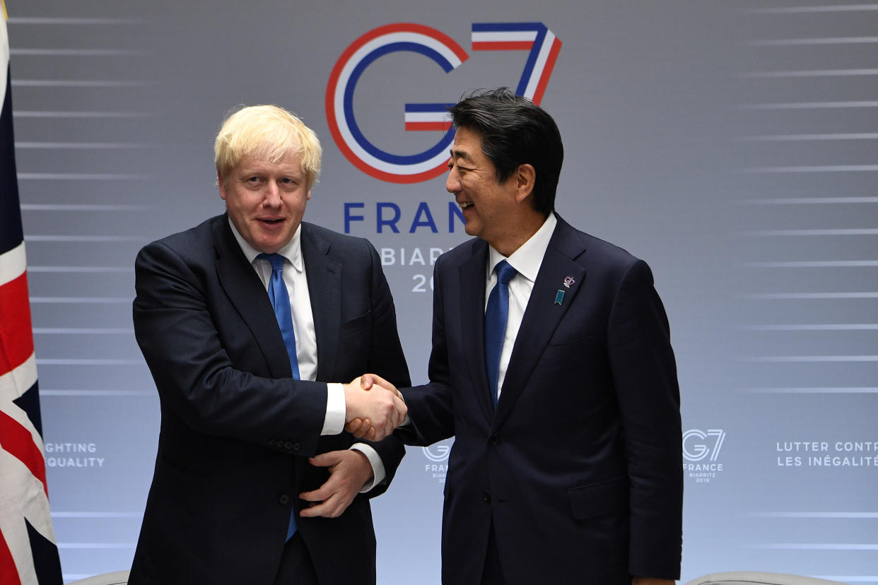 Britain's Prime Minister Boris Johnson meets with Prime Minister of Japan Shinzo Abe on day three of the G7 Summit in Biarritz, France, August 26, 2019. Andrew Parsons/Pool via REUTERS