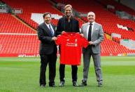 Football - Liverpool - Jurgen Klopp Press Conference - Anfield - 9/10/15 New Liverpool manager Jurgen Klopp poses with Liverpool chairman Tom Werner (L) and chief executive Ian Ayre (R) after the press conference Action Images via Reuters / Craig Brough Livepic