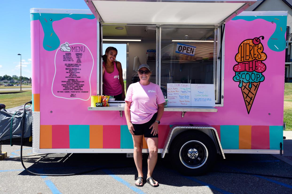 New ice cream truck Here's The Scoop employee Makayla Rice (left) and owner Tarryn Strausser stand outside the truck parked on the waterfront along Thomas Edison Parkway on Friday, July 29, 2022. Strausser said she plans to run daily specials, such as fresh-baked cookies, and introduce new menu items, such as root beer floats.