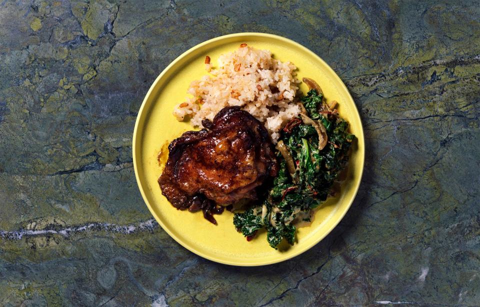 Chef Melissa Miranda’s adobo chicken, garlic fried rice, and winter greens laing.