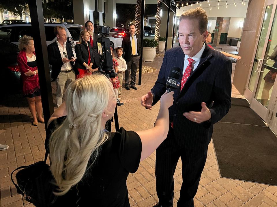 U.S. Rep. Vern Buchanan talks to a reporter on election night 2022 at GROVE Restaurant in Lakewood Ranch.