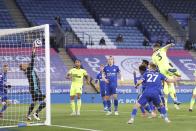 Newcastle's Paul Dummett, right, scores his team's second goal during the English Premier League soccer match between Leicester City and Newcastle United at the King Power Stadium in Leicester, England, Friday, May 7, 2021.(Alex Pantling/Pool via AP)