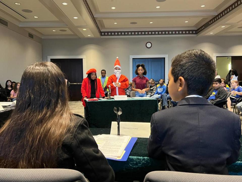 Students from Oakmont Elementary perform as prosecutors, defense attorneys and Santa Claus for a play called “Santa Claus Goes to Jail” on Friday at the Tarrant County Family Law Center in downtown Fort Worth.