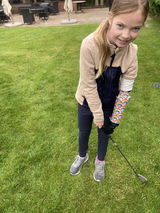 Joanie Melady testing out the golfing tool 