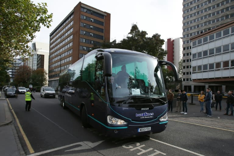 A coach carrying teenagers arrives in Croydon, south London after being transferred from the "Jungle" migrant camp in Calais