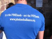 An opponent of a proposed natural gas line that would run through New Jersey's federally protected Pinelands reserve wears a T shirt criticizing the plan outside a hotel in Cherry Hill N.J., Friday Feb. 24, 2017 before a Pinelands Commission meeting at which the proposal was to be voted on. The pipeline has become one of the most hotly contested jobs vs. environment clashes in recent New Jersey history. (AP Photo/Wayne Parry)