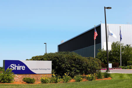 FILE PHOTO: A sign sits in front of Shire's manufacturing facility in Lexington, Massachusetts July 18, 2014. REUTERS/Brian Snyder/File Photo