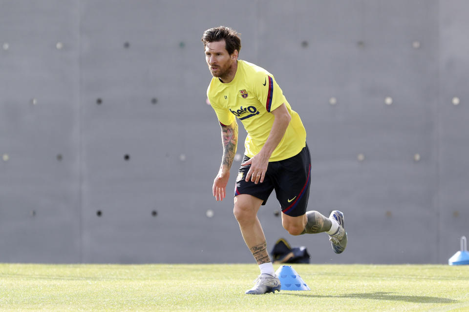 In this photo provided by FC Barcelona, Lionel Messi trains in Barcelona, Spain, on Friday May 8, 2020. Soccer players in Spain returned to train for the first time since the country entered a lockdown nearly two months ago because of the coronavirus pandemic. (Miguel Ruiz/FC Barcelona via AP)