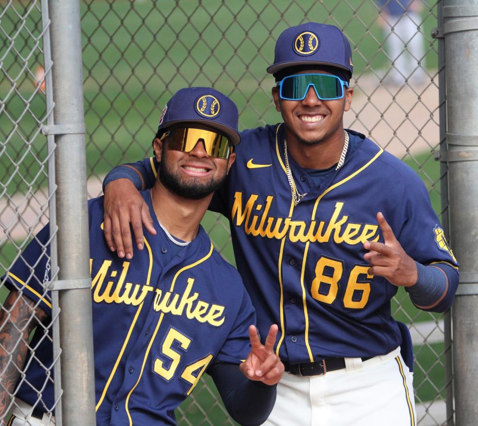 Prospects Hedbert Perez, left, and Hendry Mendez smile for a photo Monday at American Family Fields of Phoenix.