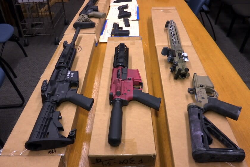 FILE - This Nov. 27, 2019 file photo shows "ghost guns" on display at the headquarters of the San Francisco Police Department in San Francisco. Chicago and three other cities sued the federal government Wednesday, Aug. 26, 2020, to stop the proliferation of what are advertised as easy-to-assemble "ghost guns" that require no serial numbers or background checks. (AP Photo/Haven Daley, FIle)