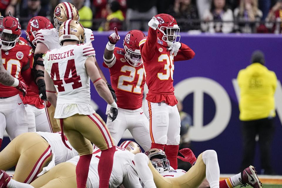 Kansas City Chiefs cornerback L'Jarius Sneed (38) and safety Mike Edwards (21) celebrate a fumble recovery against the San Francisco 49ers during the first half of the NFL Super Bowl 58 football game Sunday, Feb. 11, 2024, in Las Vegas. (AP Photo/Eric Gay)