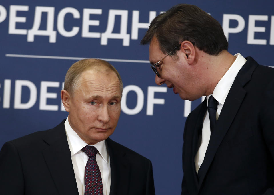 In this photo taken Thursday, Jan. 17, 2019, Russian President Vladimir Putin, left, speaks with Serbian President Aleksandar Vucic during a joint news conference in Belgrade, Serbia. Officials say on Monday, Aug. 26 Serbia will sign a free trade agreement with a Russian-led economic group, the move which could further hamper the Balkan country's proclaimed efforts to joining the European Union. (AP Photo/Darko Vojinovic)