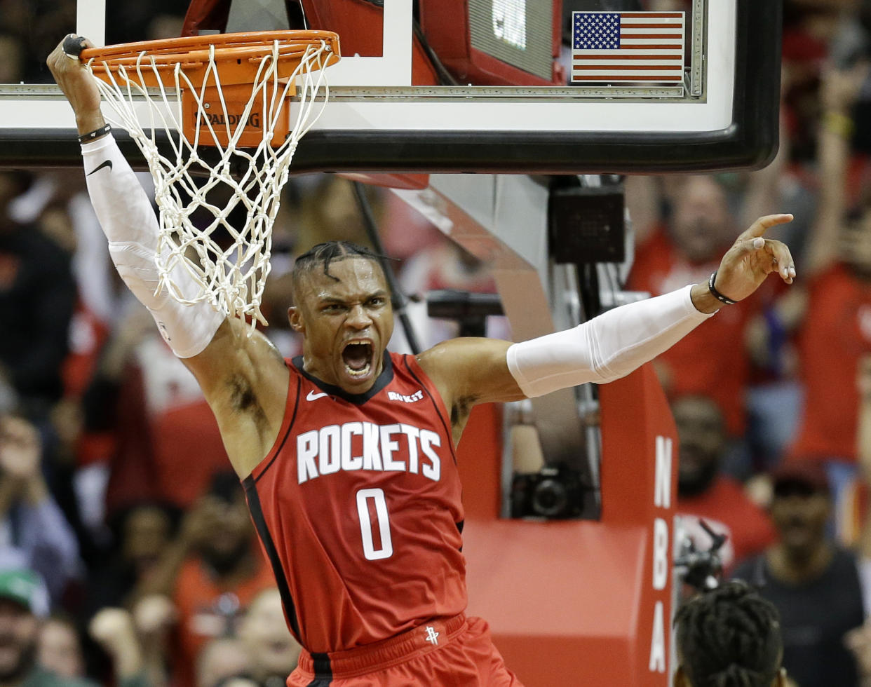 Houston Rockets guard Russell Westbrook celebrates his dunk during the second half of the teams NBA basketball game against the Milwaukee Bucks, Thursday, Oct. 24, 2019, in Houston. (AP Photo/Eric Christian Smith)