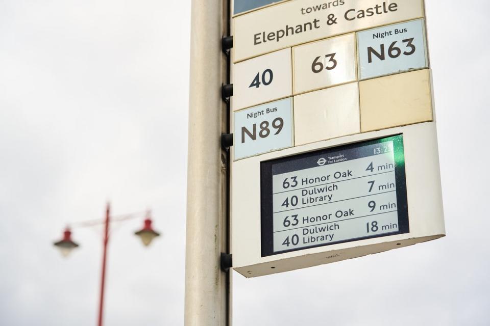 A greyscale digital sign atop a bus pole displaying live bus times (Handout)