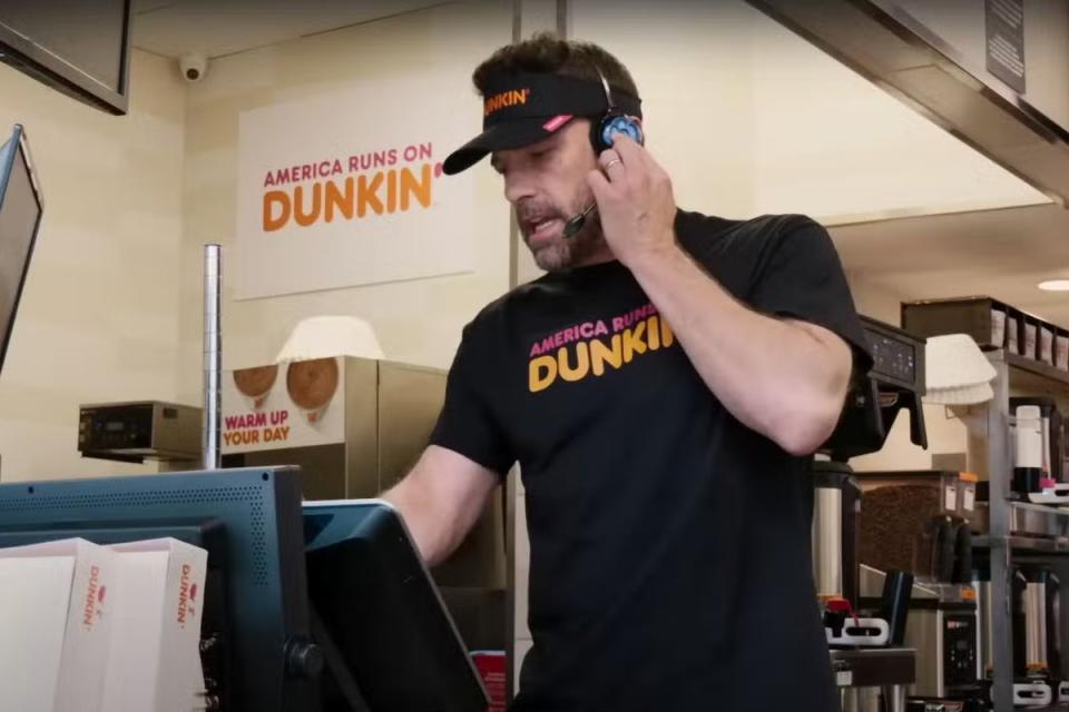 The advert sees Affleck working the drive-thru (Dunkin’ Donuts)