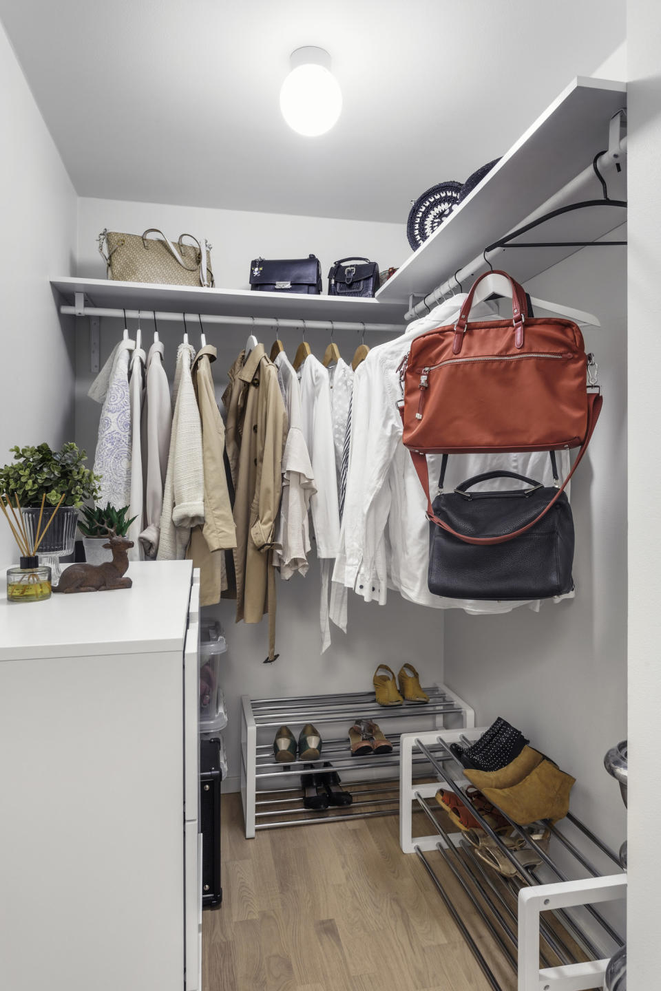 a very neat and sparse walk in closet