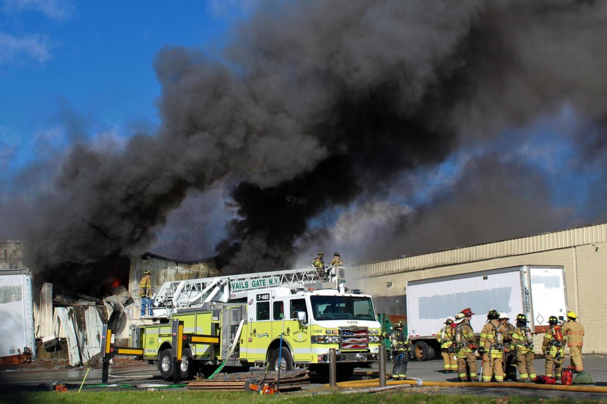 Firefighters attending the blaze were caught in a second blast: AP