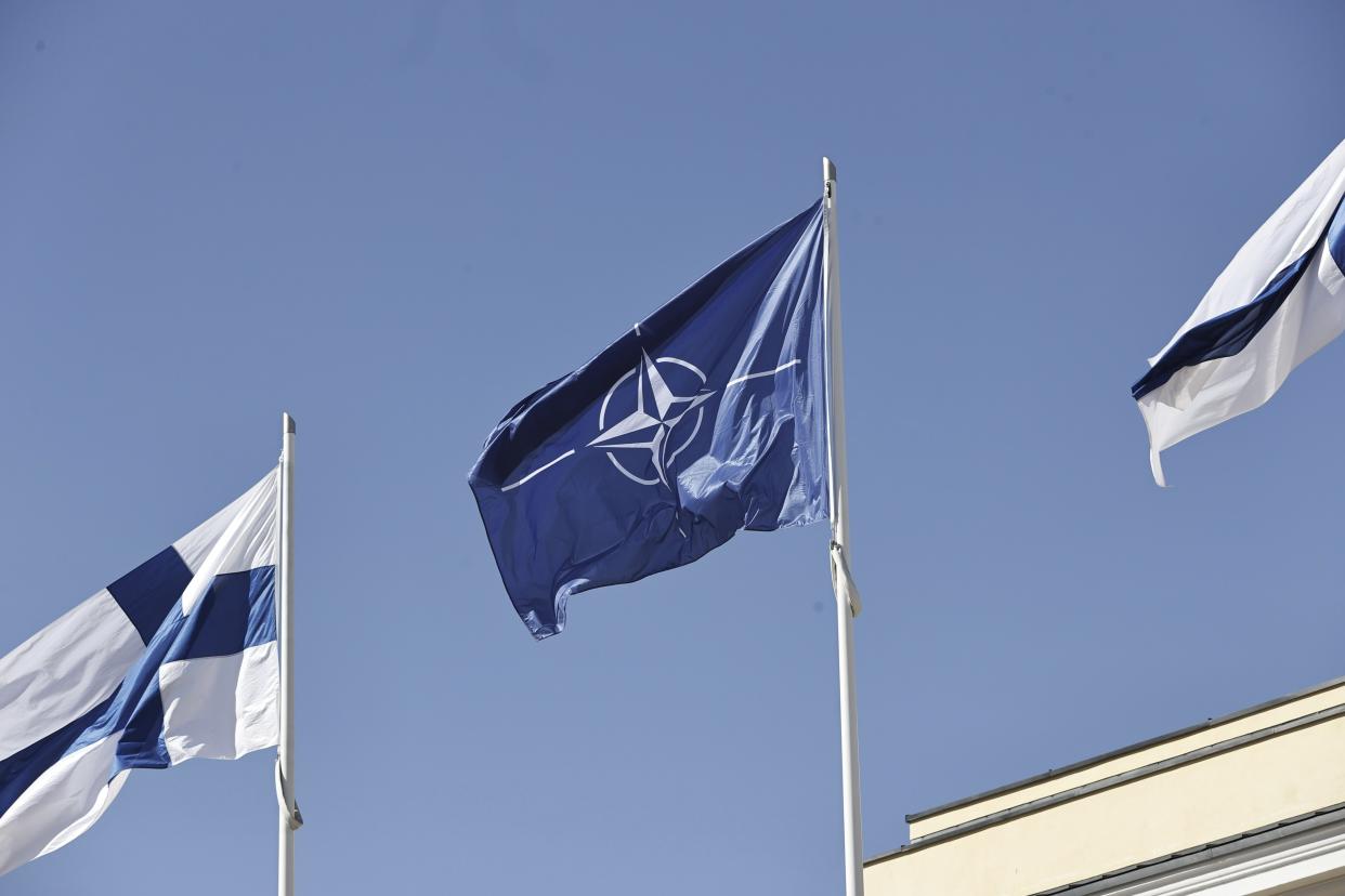Finnish and Nato flags flutter at the courtyard of the Foreign Ministry in Helsinki, Finland, Tuesday, April 4, 2023. Finland is poised to join NATO in a historic realignment brought on by Russia’s invasion of Ukraine. But the head of the military alliance said it would not send more troops to the Nordic country unless it asked for help. (Antti H'm'l'inen/Lehtikuva via AP)