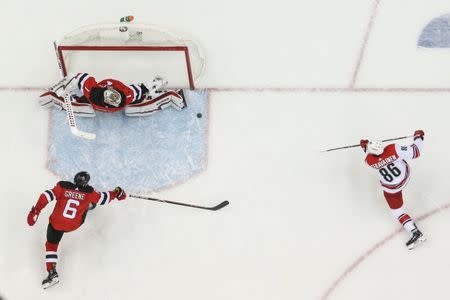 Feb 10, 2019; Newark, NJ, USA; Carolina Hurricanes left wing Teuvo Teravainen (86) scores a goal against New Jersey Devils goaltender Keith Kinkaid (1) during the third period at Prudential Center. Mandatory Credit: Ed Mulholland-USA TODAY Sports