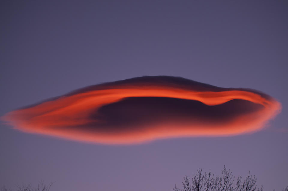 A mysterious lenticular cloud forms over the Owens Valley, Eastern Sierra, California.