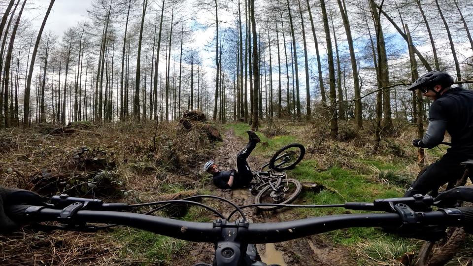 Rider laughing after a muddy crash