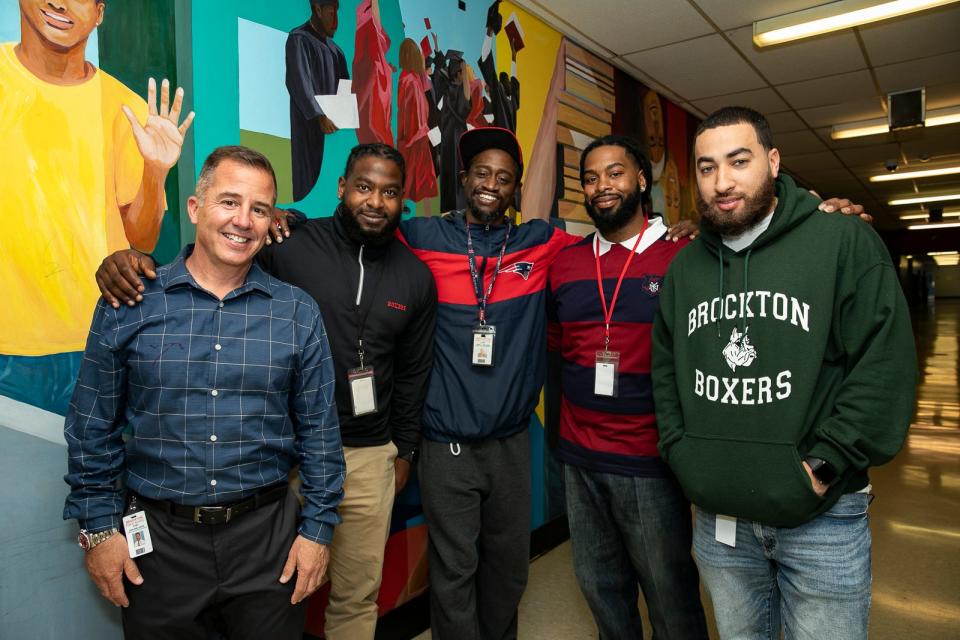 Brockton mentors John Snelgrove, Carlito Weaver, John Williams, Tristan Fortsmith and Jordan Cruz pose for a portrait at Brockton High School on Monday, May 10, 2021. [Alyssa Stone/The Enterprise]