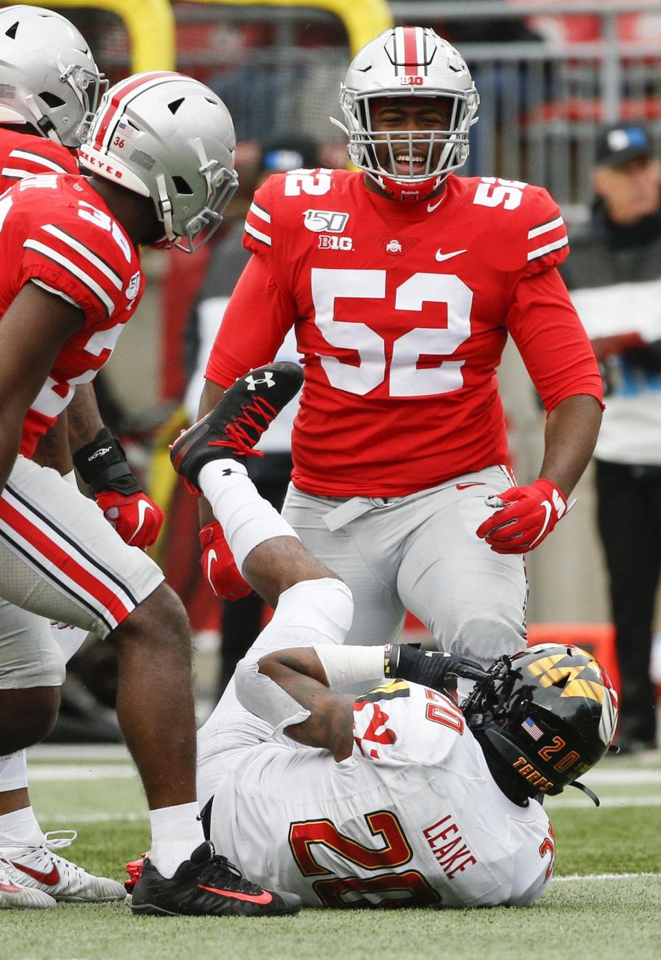 Ohio State defensive tackle Antwuan Jackson (52) has 18 tackles and 4.5 tackles for loss this season. Here he celebrates after stopping Maryland running back Javon Leake (20).