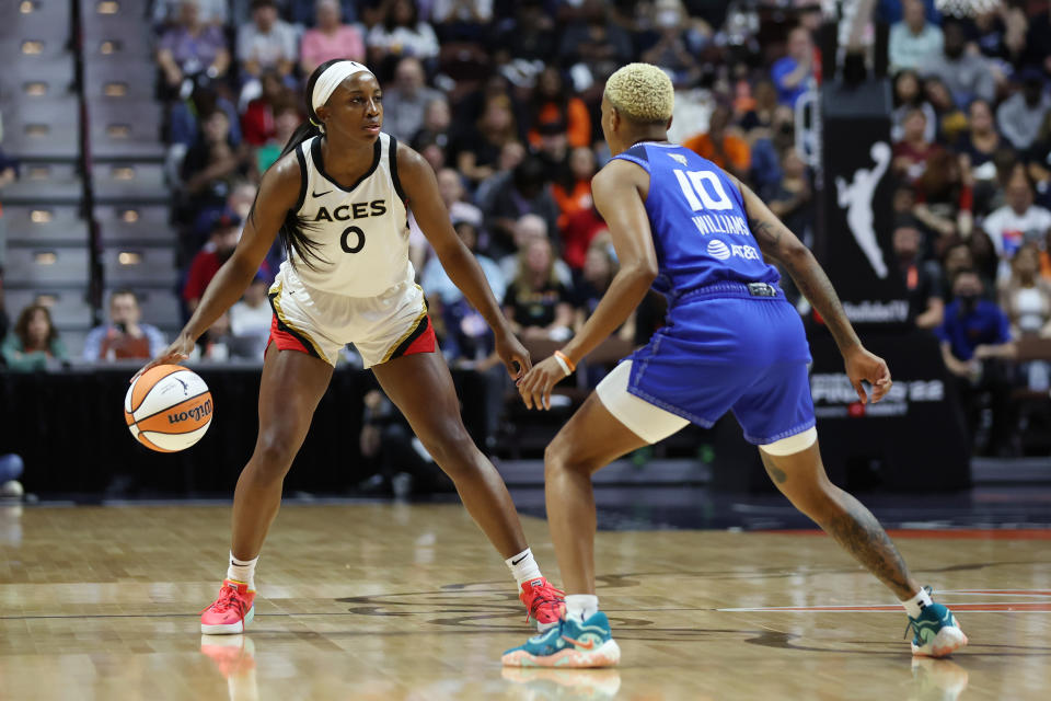 UNCASVILLE, CONNECTICUT – SEPTEMBER 15: Jackie Young #0 of the Las Vegas Aces dribbles against <a class="link " href="https://sports.yahoo.com/wnba/players/5618" data-i13n="sec:content-canvas;subsec:anchor_text;elm:context_link" data-ylk="slk:Courtney Williams;sec:content-canvas;subsec:anchor_text;elm:context_link;itc:0">Courtney Williams</a> #10 of the Connecticut Sun in the first quarter during Game Three of the 2022 WNBA Finals at Mohegan Sun Arena on September 15, 2022 in Uncasville, Connecticut. (Photo by Maddie Meyer/Getty Images)