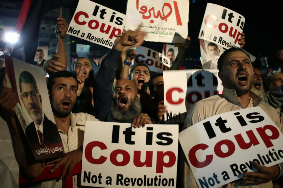 Supporters of Egypt's ousted President Mohammed Morsi chant slogans against Egyptian Defense Minister Gen. Abdel-Fattah el-Sissi at Nasr City, where protesters have installed a camp and hold daily rallies, in Cairo on July 28, 2013. (Hassan Ammar/AP)
