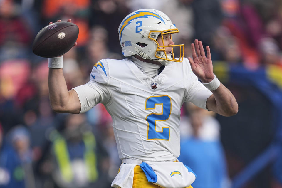 Los Angeles Chargers quarterback Easton Stick (2) passes in the pocket against the Denver Broncos during the first half of an NFL football game, Sunday, Dec. 31, 2023, in Denver. (AP Photo/Jack Dempsey)