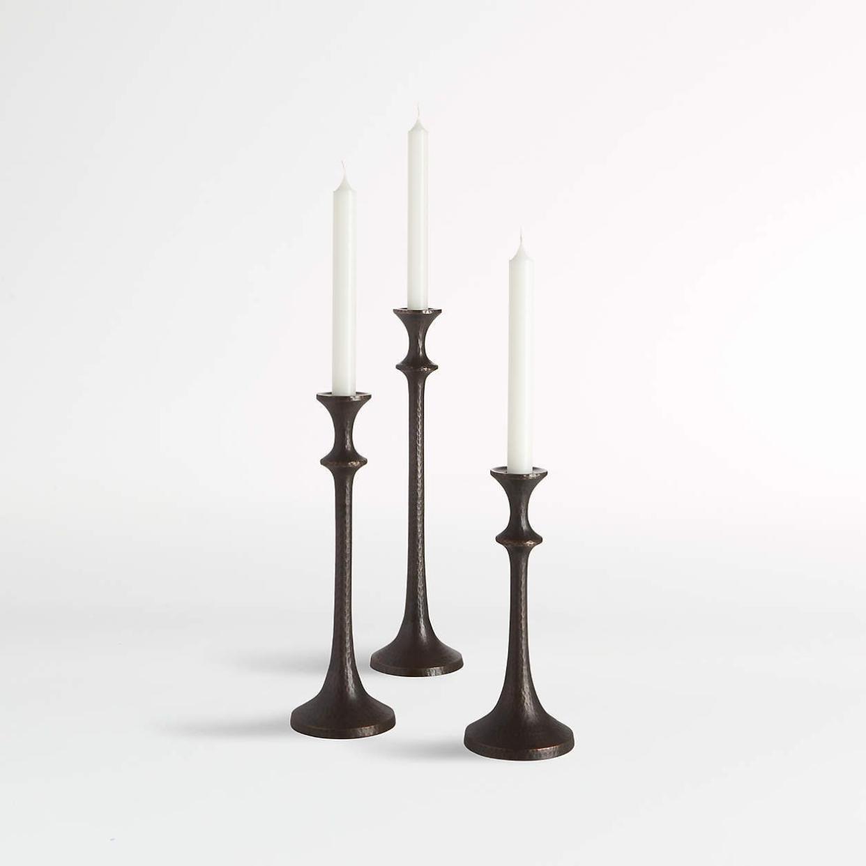 <p><a href="https://go.redirectingat.com?id=74968X1596630&url=https%3A%2F%2Fwww.potterybarn.com%2Fproducts%2Frio-bronze-taper-holders-set-of-3%2F&sref=https%3A%2F%2F" rel="nofollow noopener" target="_blank" data-ylk="slk:Shop Now;elm:context_link;itc:0;sec:content-canvas" class="link rapid-noclick-resp">Shop Now</a></p><p>Rio Bronze Taper Holders</p><p>potterybarn.com</p><p>$89.00</p>