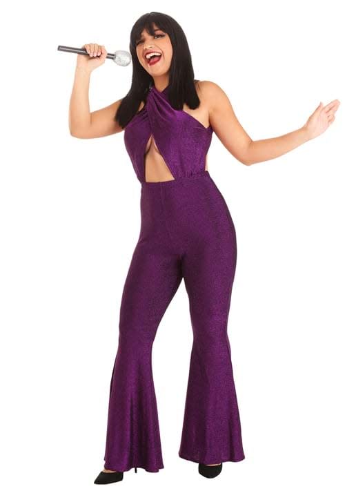 model in purple jumpsuit with black high heels and microphone