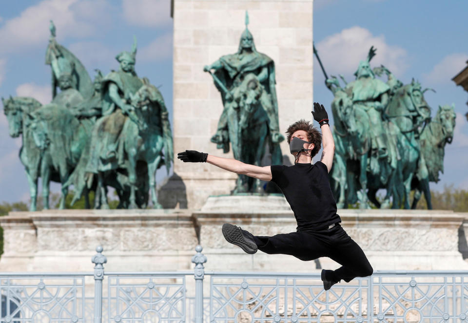 Hungarian ballet dancer Zsolt Kovacs performs a choreographic piece he has designed for the 'coronavirus melody', a musical composition created by MIT scientists from a model of the protein structure of SARS-CoV-2, during the coronavirus disease (COVID-19) outbreak in Budapest, Hungary, April 28, 2020. Picture taken April 28, 2020. REUTERS/Bernadett Szabo     TPX IMAGES OF THE DAY