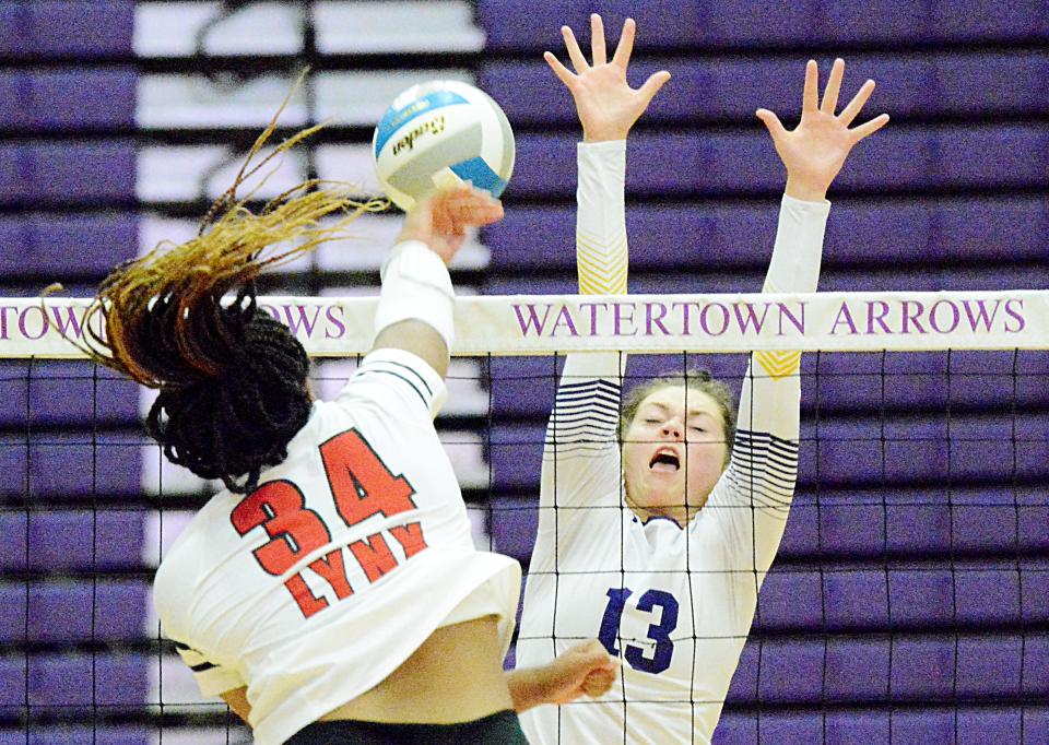 Watertown's Carter Jurrens (13) defends at the net against Brandon Valley's Mya Hejl during their Eastern South Dakota Conference volleyball match Thursday night in the Civic Arena. The Arrows won 3-2.