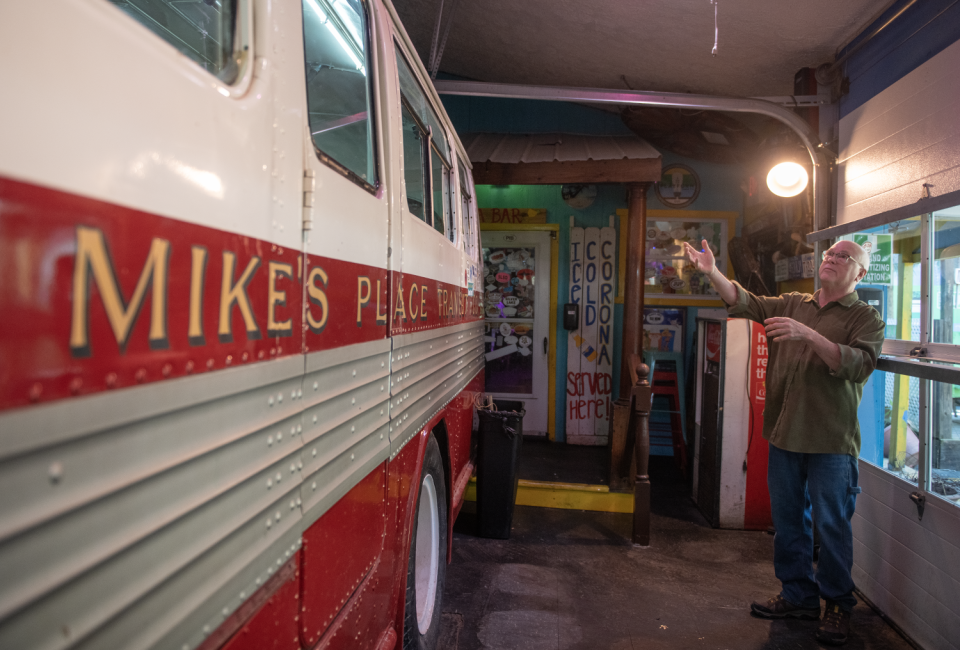 Mike's Place owner, Mike Kostensky, near the bus seating section of a 1947 twin coach that was made in Kent.