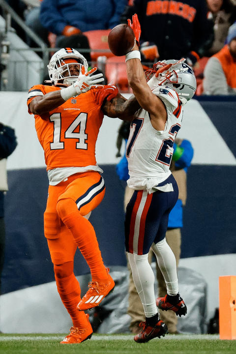 Dec 24, 2023; Denver, Colorado, USA; New England Patriots cornerback Myles Bryant (27) deflects a pass intended for Denver Broncos wide receiver Courtland Sutton (14) in the first quarter at Empower Field at Mile High. Mandatory Credit: Isaiah J. Downing-USA TODAY Sports