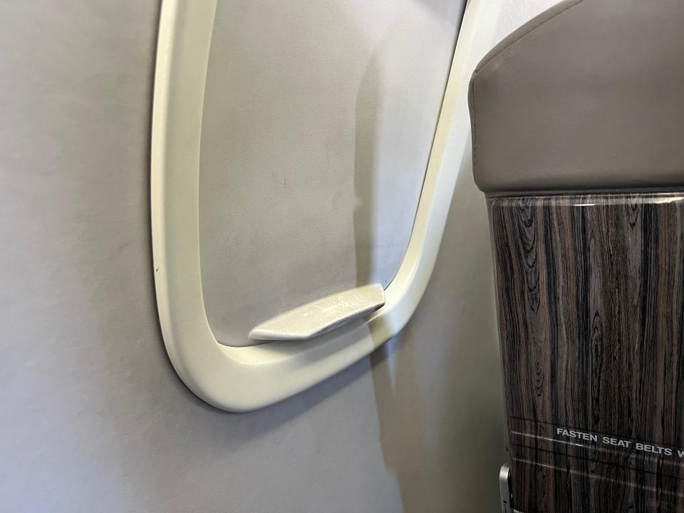 The closed window shade on the JSX plane.