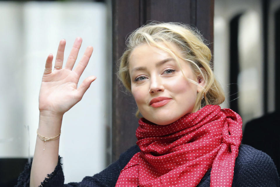 Actress Amber Heard arrives at the High Court for a hearing in actor Johnny Depp's libel case, in London, Monday July 13, 2020. Depp is expected to wrap up his evidence at his libel trial against a tabloid newspaper that accused him of abusing ex-wife Amber Heard. The Hollywood star is suing News Group Newspapers, publisher of The Sun, and the paper’s executive editor, Dan Wootton, over an April 2018 article that called him a “wife-beater.” (Aaron Chown/PA via AP)