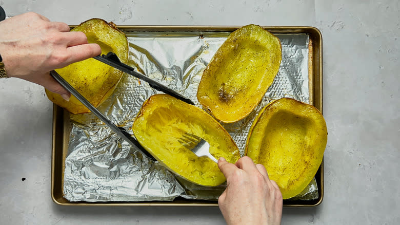 shredding squash with forks