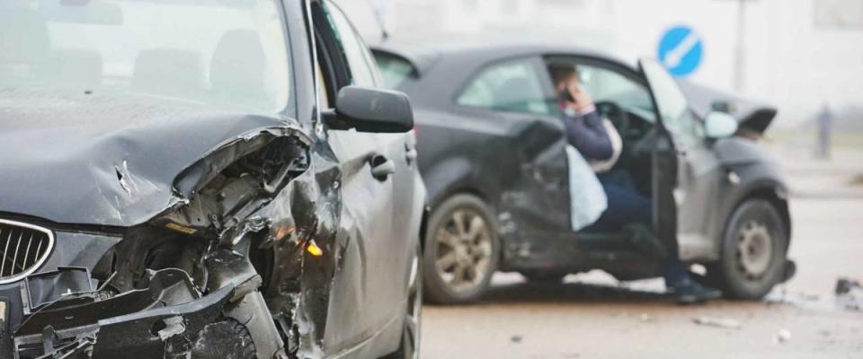 car crash accident on street, damaged automobiles after collision in city